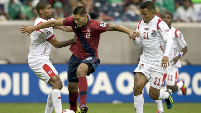 Clint Dempsey fights off Panamanian defenders during the 2011 Gold Cup