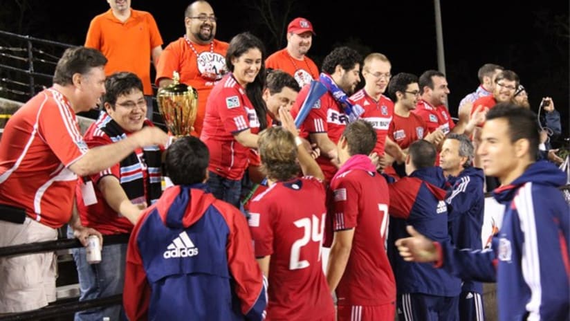 Fire players greet fans after their win over Real España in New Orleans.