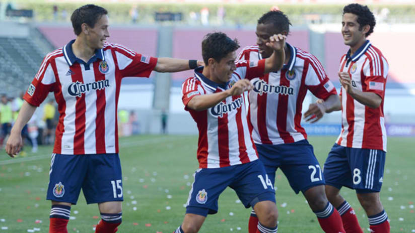 Chivas USA players celebrate with Giovanni Casillas (center)
