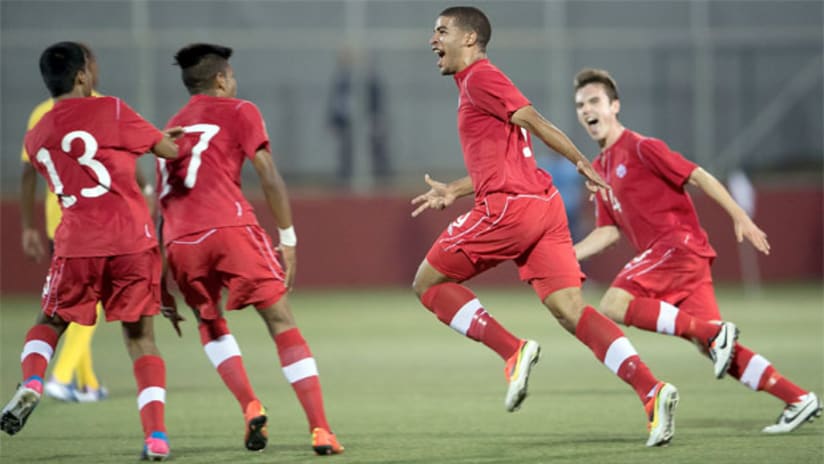 Jordan Hamilton and the Canadian U-17 team celebrate their win over Jamaica