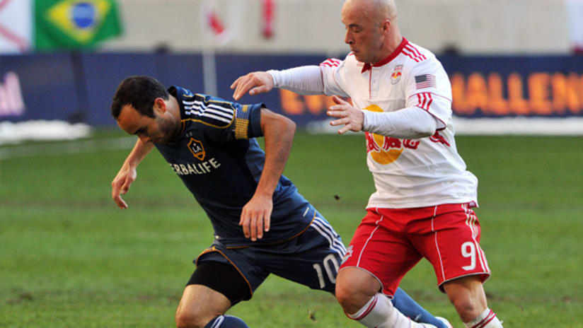 Galaxy's Landon Donovan (left) and Red Bulls' Luke Rodgers vie for possession.
