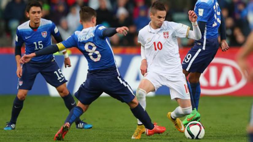 Marco Delgado and Emerson Hyndman bracket a Serbian attacker US U-20 World Cup