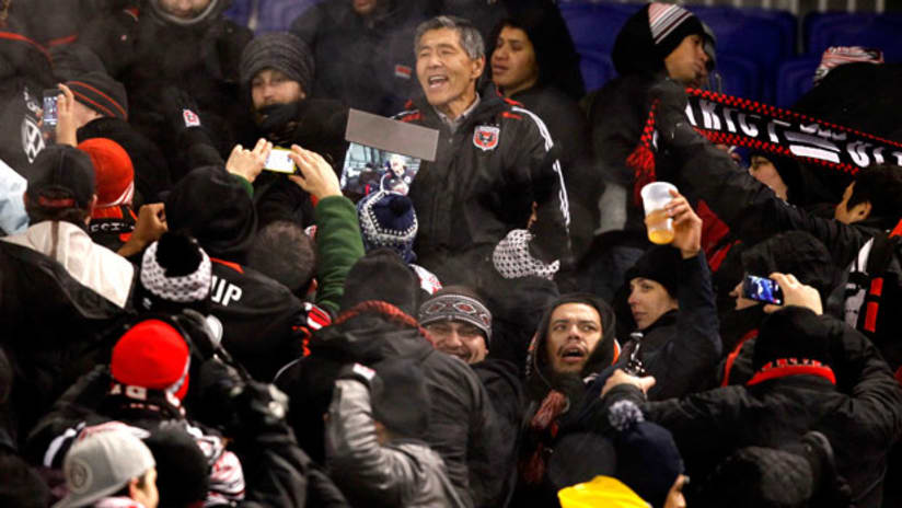 D.C. United Executive Chairman Will Chang sings with the supporters at Red Bull Arena, November 7, 2012