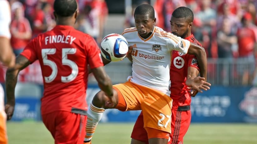 Houston Dynamo's Boniek Garcia battles with Toronto FC players