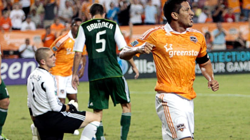 Houston's Brian Ching celebrates after his goal vs. Portland.