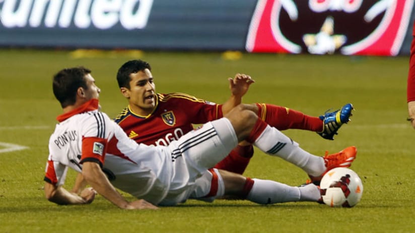 DC's Chris Pontius and Real Salt Lake's Tony Beltran challenge during the Open Cup final