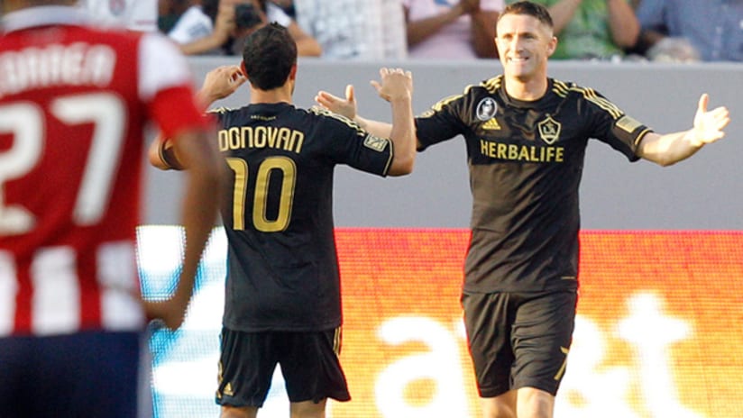 LA's Landon Donovan and Robbie Keane celebrate after scoring vs. Chivas USA