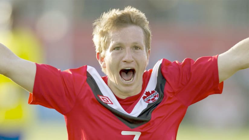Terry Dunfield celebrates a goal for Canada.