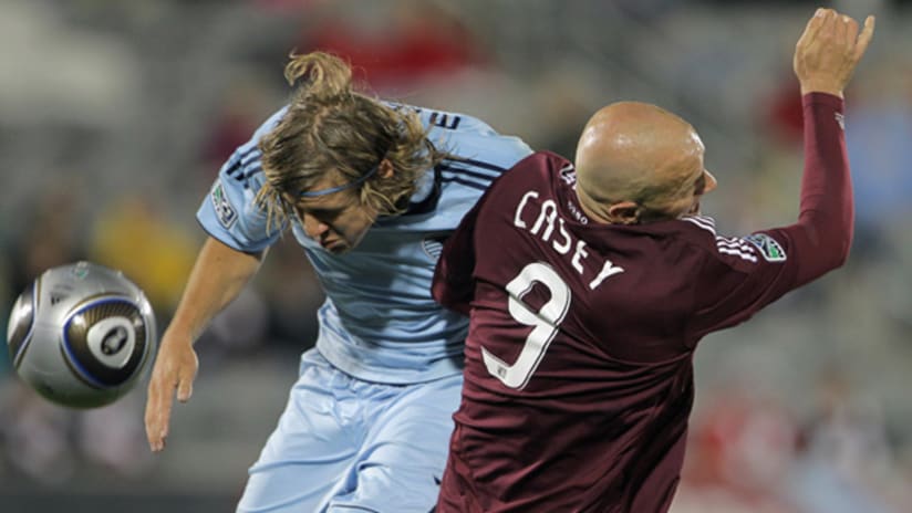 Sporting's Chance Myers (left) collides with Colorado's Conor Casey on Saturday night at Dick's Sporting Goods Park.