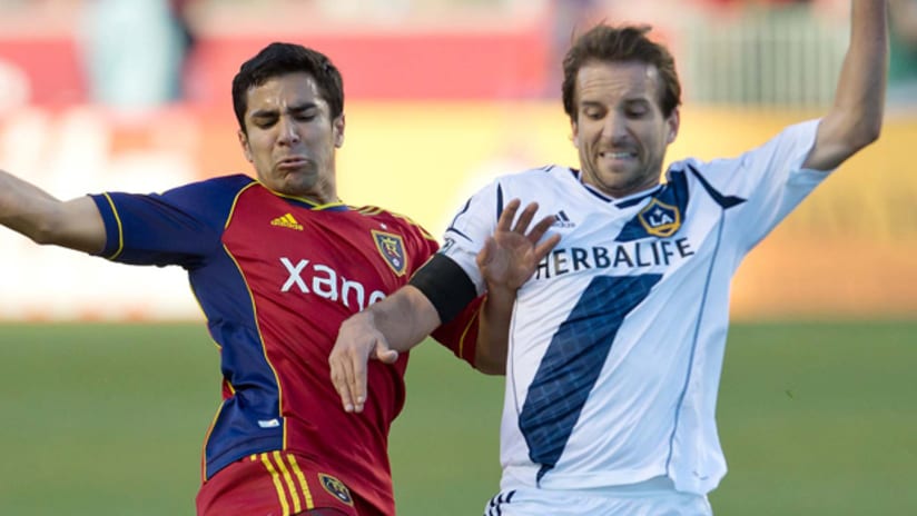 Tony Beltran and Mike Magee battle for the ball