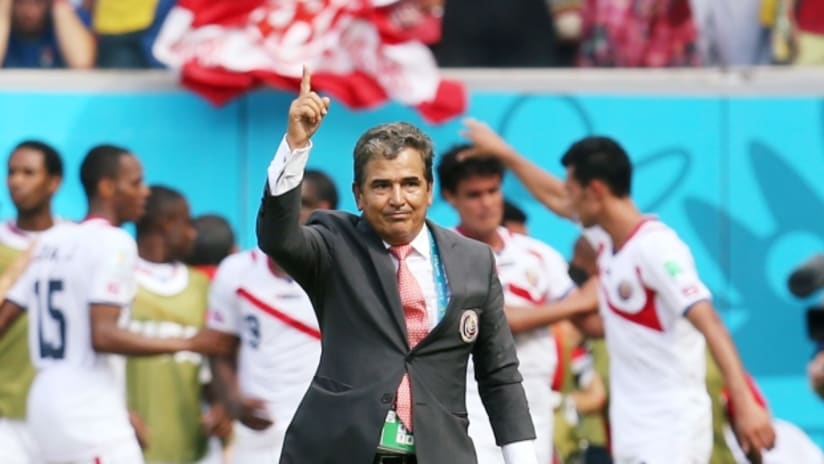 Costa Rica coach Jorge Luis Pinto points skyward after Bryan Ruiz's opening goal against Italy.