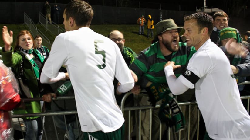 Brunner and Jewsbury celebrate with the Timbers Army