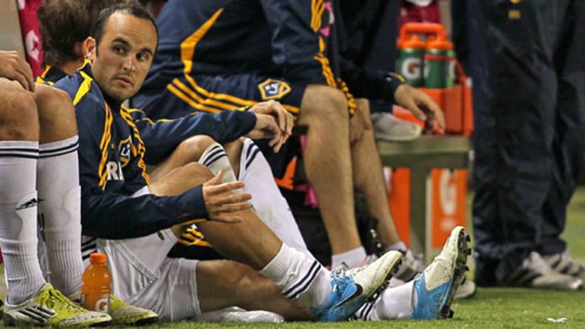 Landon Donovan sits on the bench after he was injured during LA's loss to RSL on Saturday
