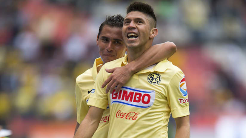 Club America's Oribe Peralta and Paul Aguilar celebrate a goal