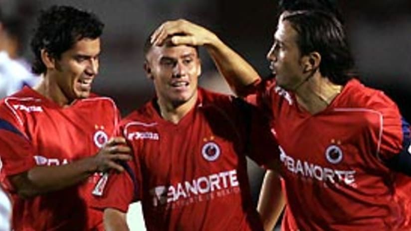 Lucas Ayala (center) is congratulated on his goal, which helped Veracruz to the win.