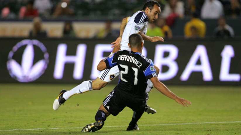 Jason Hernandez of San Jose tries to stop Landon Donovan of LA
