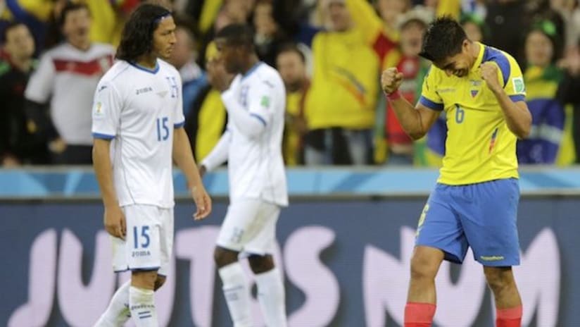 Ecuador's Cristian Noboa celebrates their win over Honduras as Roger Espinoza looks on