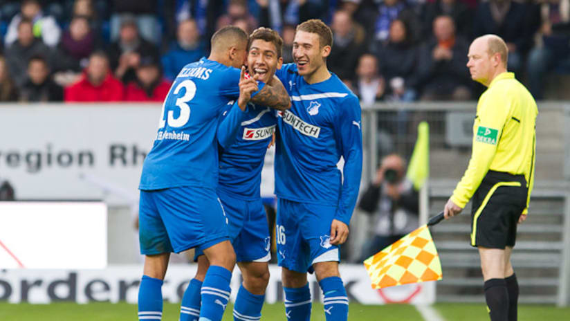 Fabian Johnson, Daniel Williams celebrate with a Hoffenheim teammate after a goal vs. Augsburg