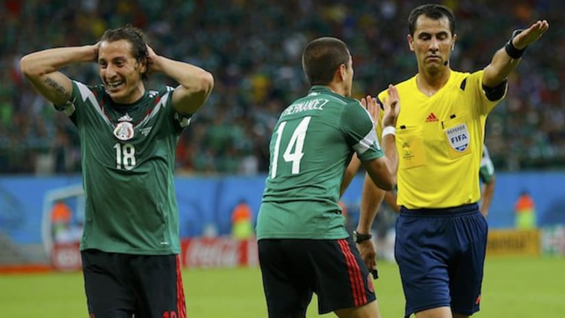Andres Guardado and Javier Hernandez react to referee Ravshan Irmatov's call in Mexico-Croatia