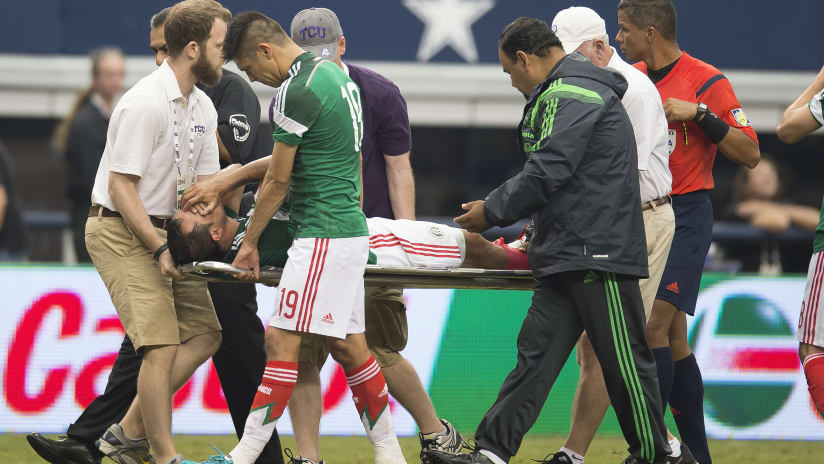 Luis Montes, comes off injured for Mexico