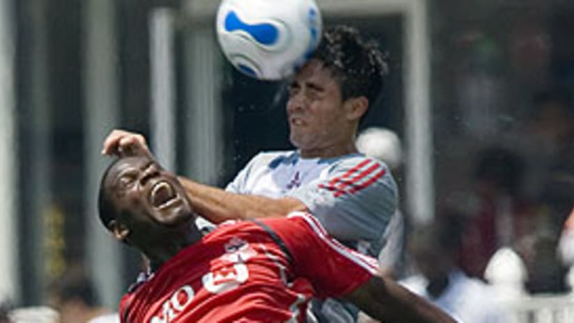 Marcelo Saragosa (R) and FC Dallas were undone by Maurice Edu and Toronto FC.