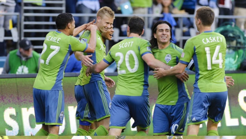 Seattle celebrate Andy Rose's goal vs. Vancouver