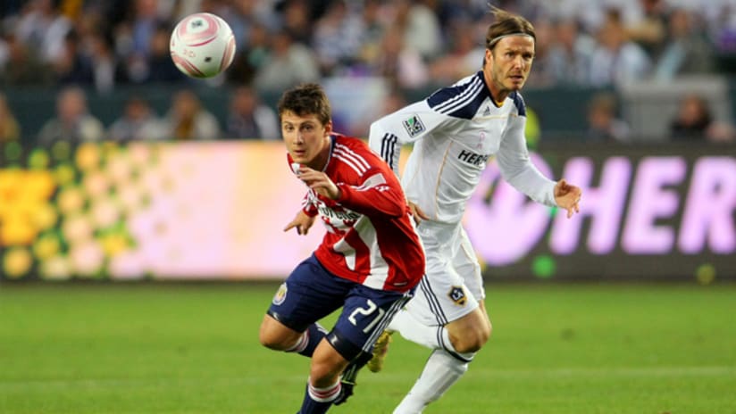 Chivas USA's Ben Zemanski (left) and Galaxy's David Beckham vie for possession