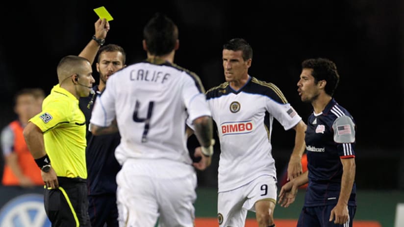 New England's Benny Feilhaber (right) is issued a second yellow card against the Philadelphia Union on Sunday.