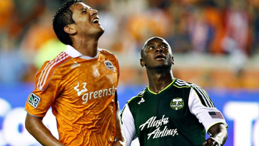 Houston's Brian Ching reacts after missing an attempt against Portland.