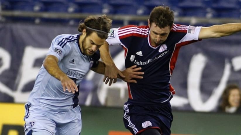 Andy Dorman (New England Revolution) and Graham Zusi (Sporting KC) battle for the ball