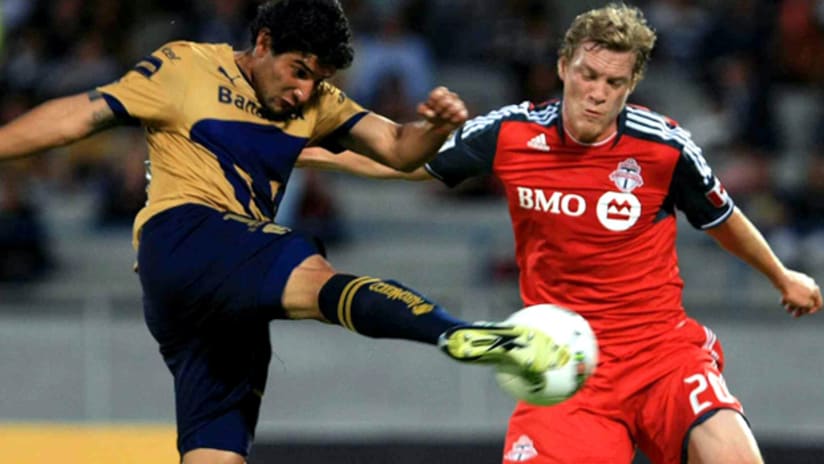 Pumas forward Martin Bravo gets a shot off in front of Toronto's Ty Harden.