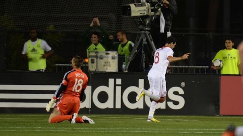 Diego Valeri celebrates his goal as Jon Busch looks on