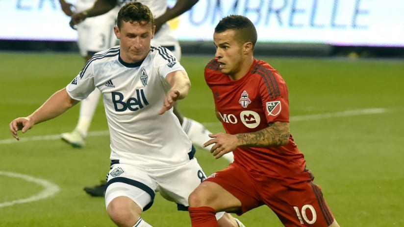 Fraser Aird, Sebastian Giovinco - Vancouver Whitecaps, Toronto FC - battle for a ball in Canadian Championship