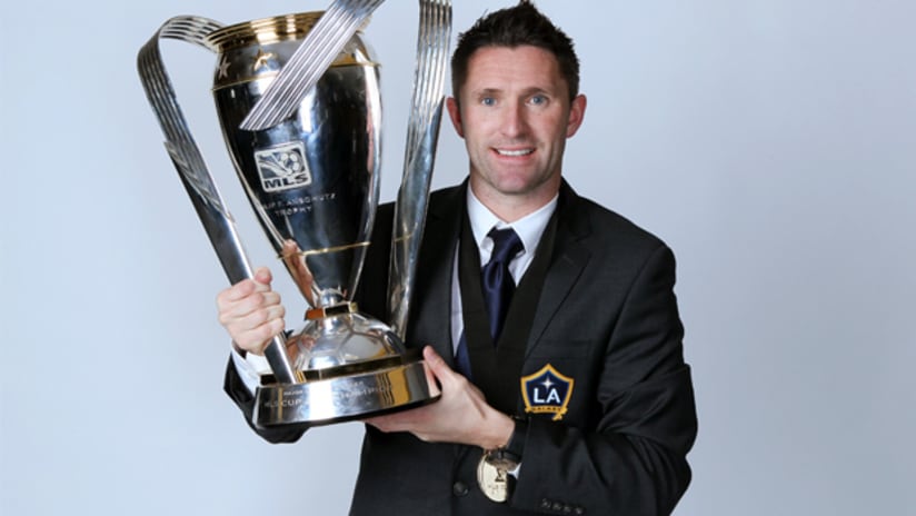 LA Galaxy forward Robbie Keane holds up the MLS Cup trophy