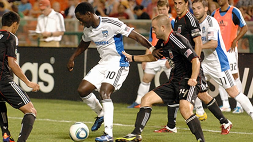 Brian Dawkins of the San Jose Earthquakes dribbles past the D.C. United defense.