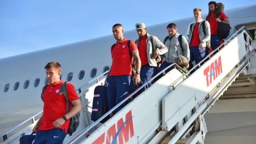 USMNT players exit their flight after landing in Brazil