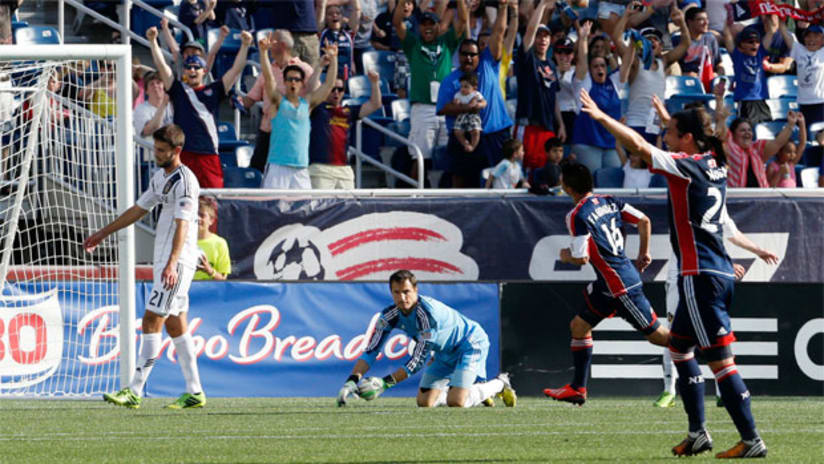 Lee Nguyen and Diego Fagundez celebrate as Carlo Cudicini looks on