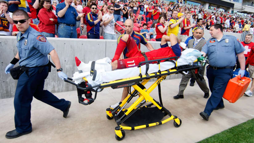 RSL midfielder Javier Morales is stretchered off the field following a tackle by Chivas' Marcos Mondaini.