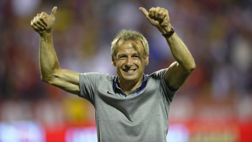 Jurgen Klinsmann celebrates the USMNT's World Cup qualification