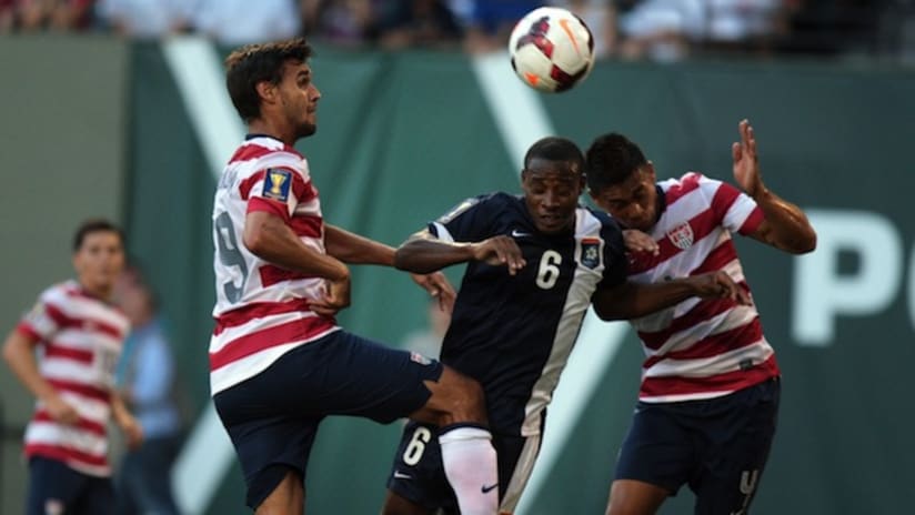 Chris Wondolowski and Michael Orozco Fiscal go up for a ball vs. Belize