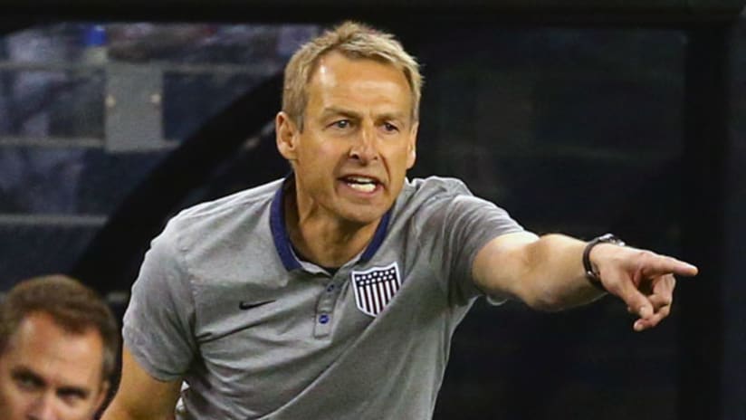 Jurgen Klinsmann gestures with purpose during the USMNT-Mexico friendly