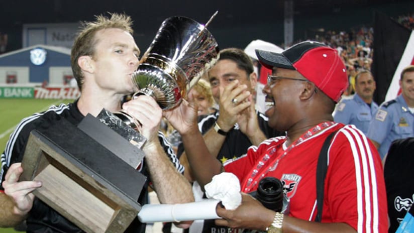 Bryan Namoff kisses the Atlantic Cup after D.C. United won the season series against the New York Red Bulls in 2008.