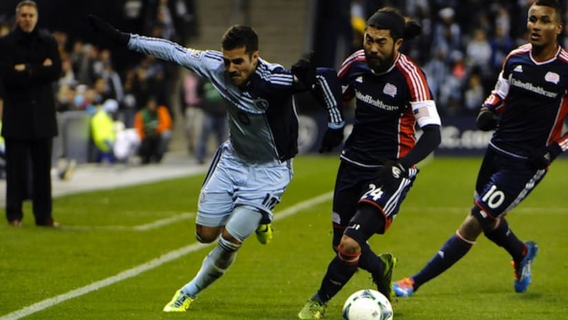 Benny Feilhaber and Lee Nguyen battle for the ball in the Sporting KC-New England playoff game