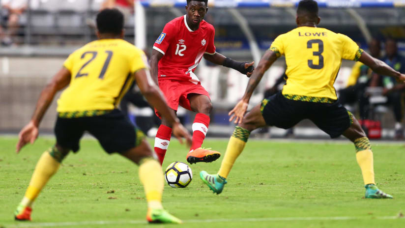 Alphonso Davies - Canada - passes in front of two Jamaican players - 2017 Gold Cup
