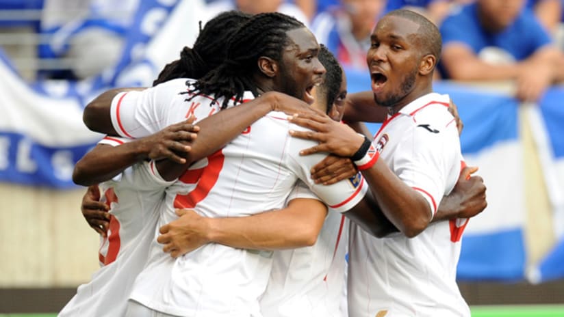 Trinidad & Tobago celebrate a Keon Daniel goal; Kenwyne Jones in foreground