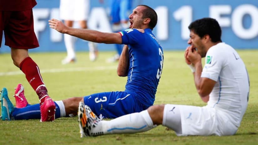 Italy's Giorgio Chiellini reacts after Uruguay's Luis Suarez bit him