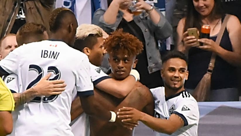 Yordy Reyna - Vancouver Whitecaps - gets mobbed by teammates after scoring late winner
