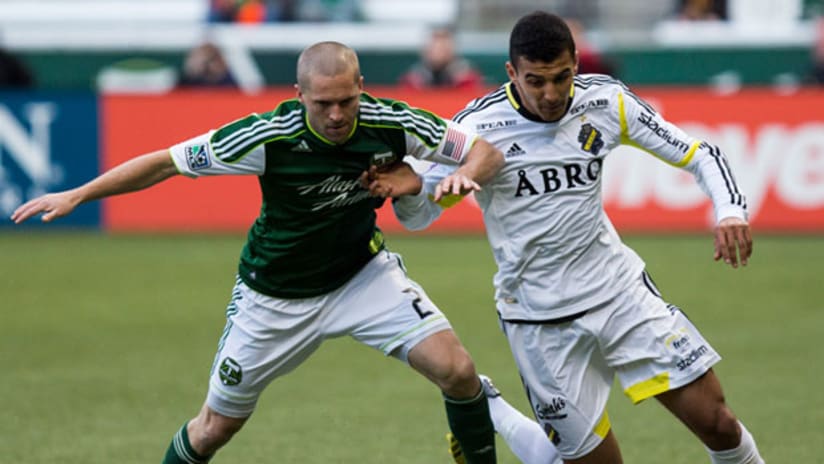 Portland's Ryan Miller battles an AIK player on Saturday