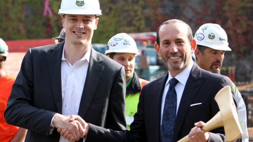 Timbers owner Merritt Paulson presented MLS commissioner Don Garber with a golden axe.