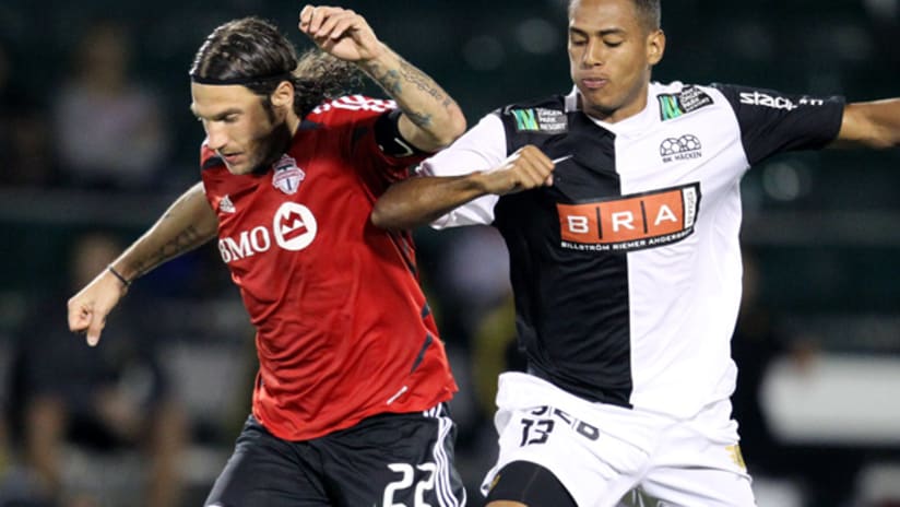 Toronto FC's Torsten Frings vies for the ball with a Hacken player